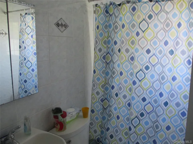 a bathroom with a shower curtain