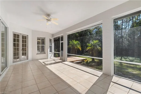 a living room with a large window and table