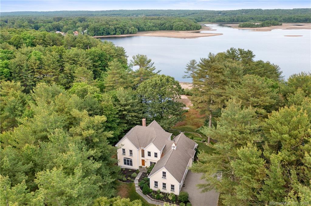 an aerial view of a house with a lake view