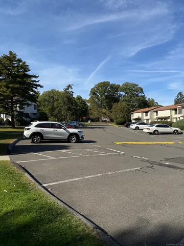a view of street with parked cars