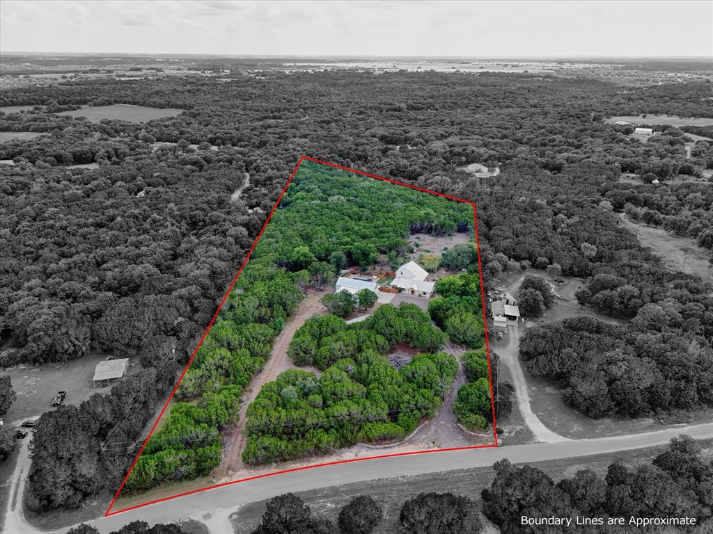 286 Benevolence Way China Spring, TX 76633 - Photo 37 of 37 Expansive wooded acreage featuring a main residence and additional structures amidst mature trees