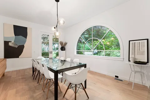 a view of a dining room with furniture window and outside view