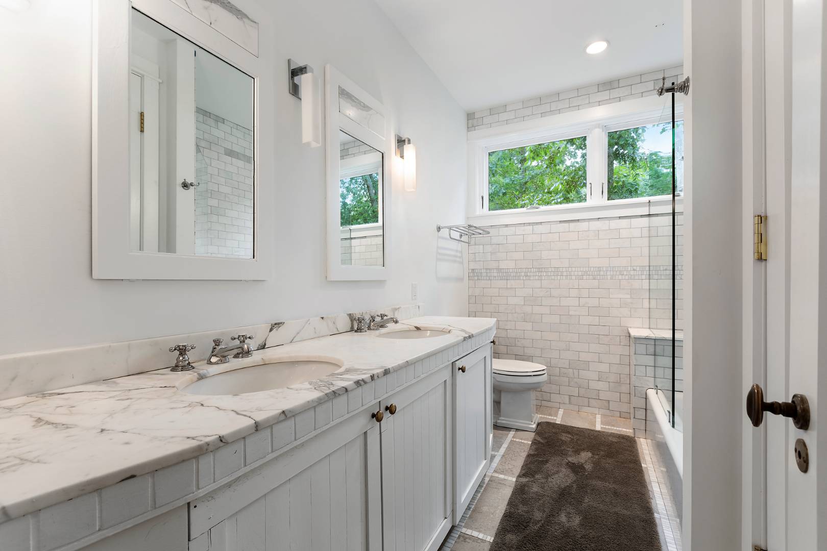 112 Georgica Close Road East Hampton, NY 11937 - Photo 15 of 46 a bathroom with a granite countertop sink a large mirror a and a shower