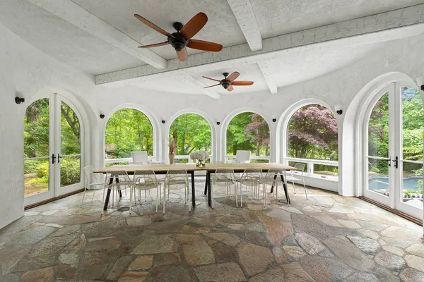 a view of a patio with table and chairs