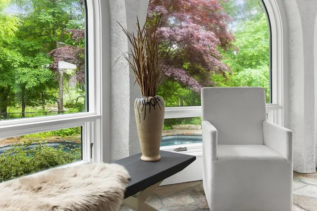 a view of backyard with seating area