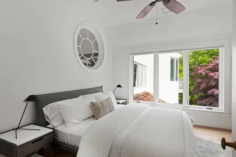 a bedroom with a bed and window