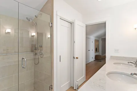 a bathroom with a sink and shower
