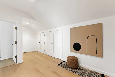 a bedroom with a bed and a cabinets