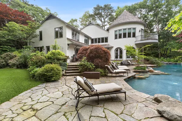 a front view of a house with garden