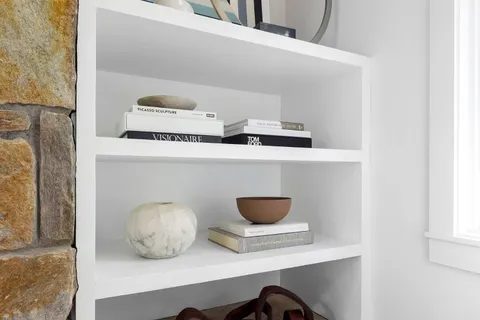 a living room with furniture and a lamp