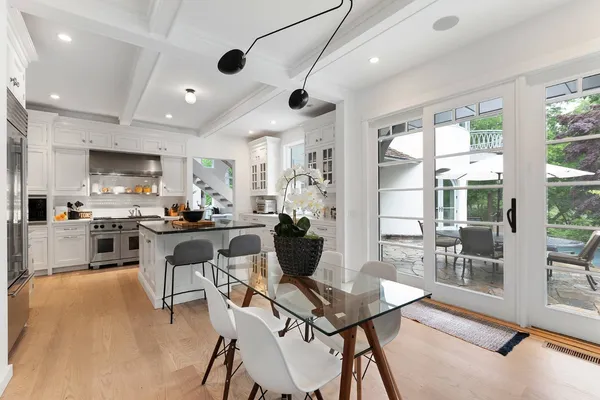a living room with stainless steel appliances kitchen island granite countertop furniture and a view of kitchen