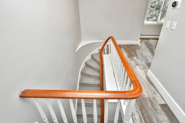 a view of staircase with a rug