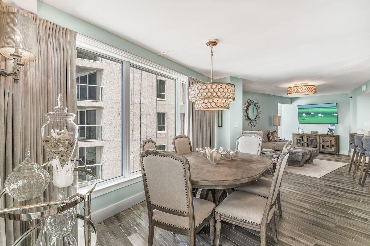 4323 Beachside 2, Unit 323 Miramar Beach, FL 32550 - Photo 11 of 41 a view of a dining room with furniture window and wooden floor