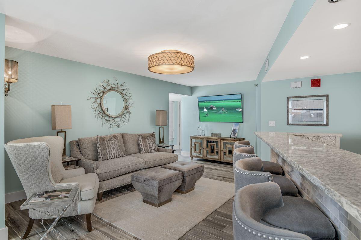 4323 Beachside 2, Unit 323 Miramar Beach, FL 32550 - Photo 12 of 41 a living room with furniture and a wooden floor