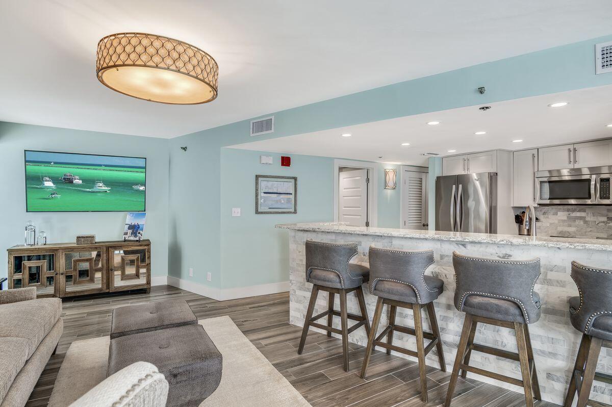 4323 Beachside 2, Unit 323 Miramar Beach, FL 32550 - Photo 13 of 41 a living room with furniture and a wooden floor