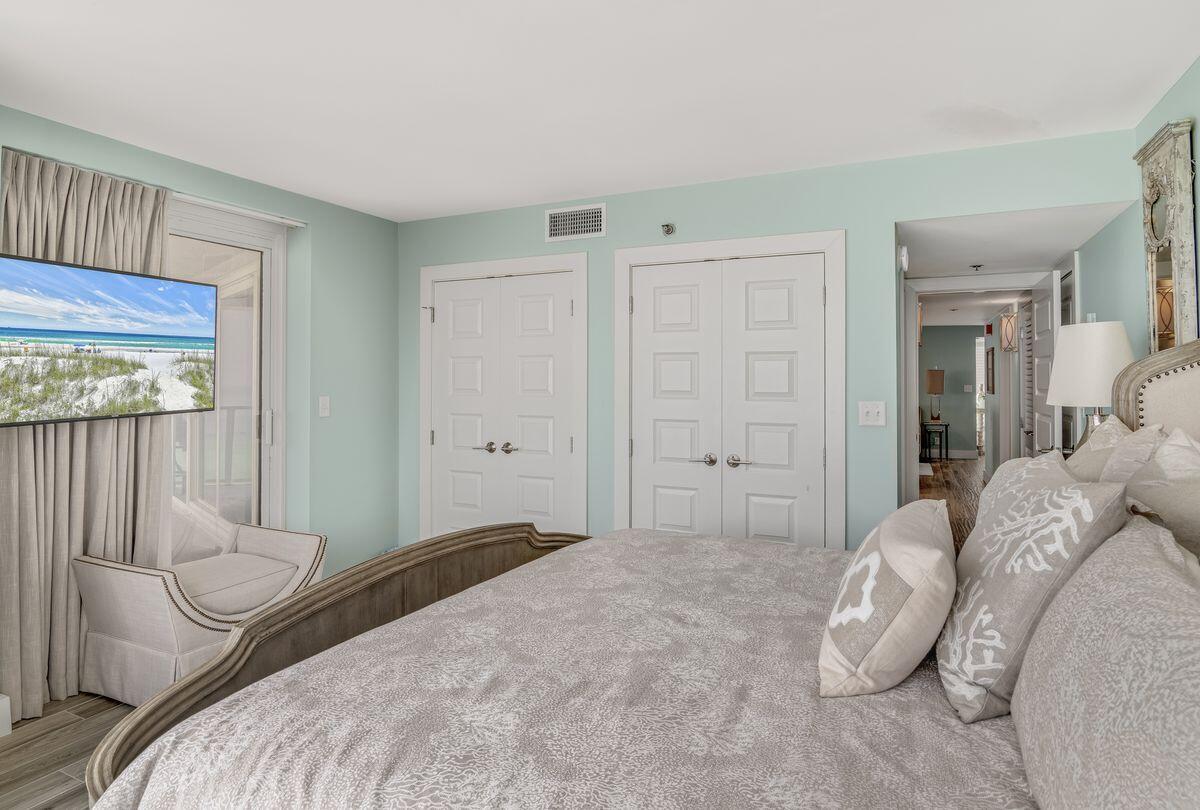 4323 Beachside 2, Unit 323 Miramar Beach, FL 32550 - Photo 19 of 41 a bedroom with a bed and a large window