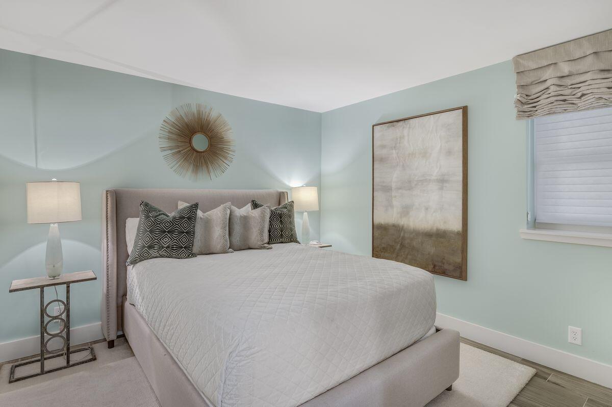 4323 Beachside 2, Unit 323 Miramar Beach, FL 32550 - Photo 22 of 41 a large bed sitting in a bedroom next to a lamp