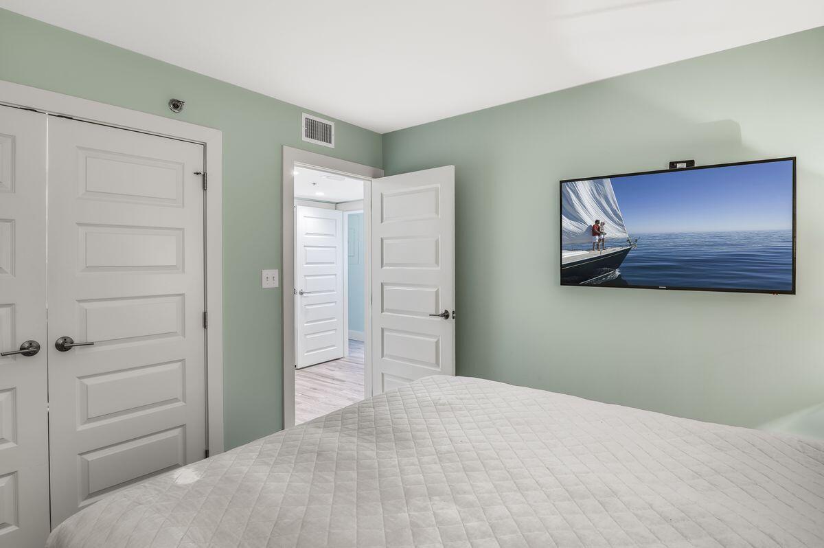 4323 Beachside 2, Unit 323 Miramar Beach, FL 32550 - Photo 23 of 41 a bedroom with a bed and a dresser