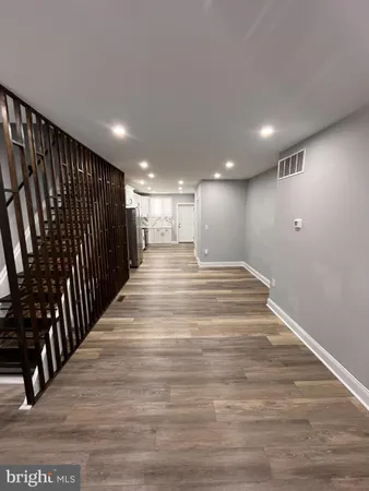 a view of gallery with wooden floor