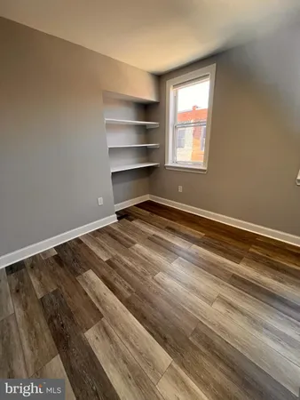 a view of room with window and closet