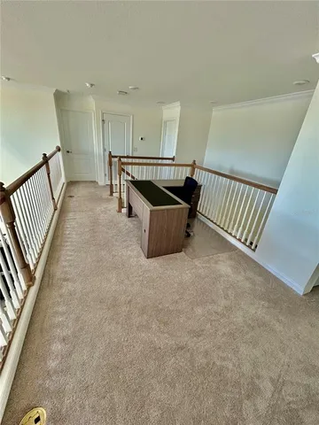 a view of kitchen with furniture and windows