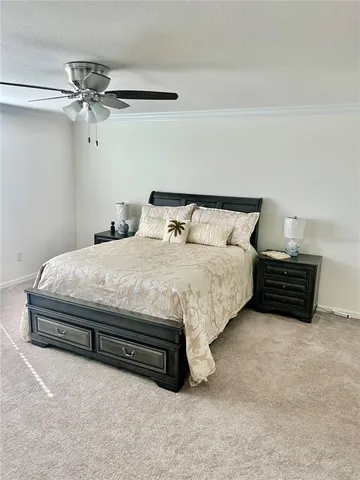 a bedroom with bed and a window