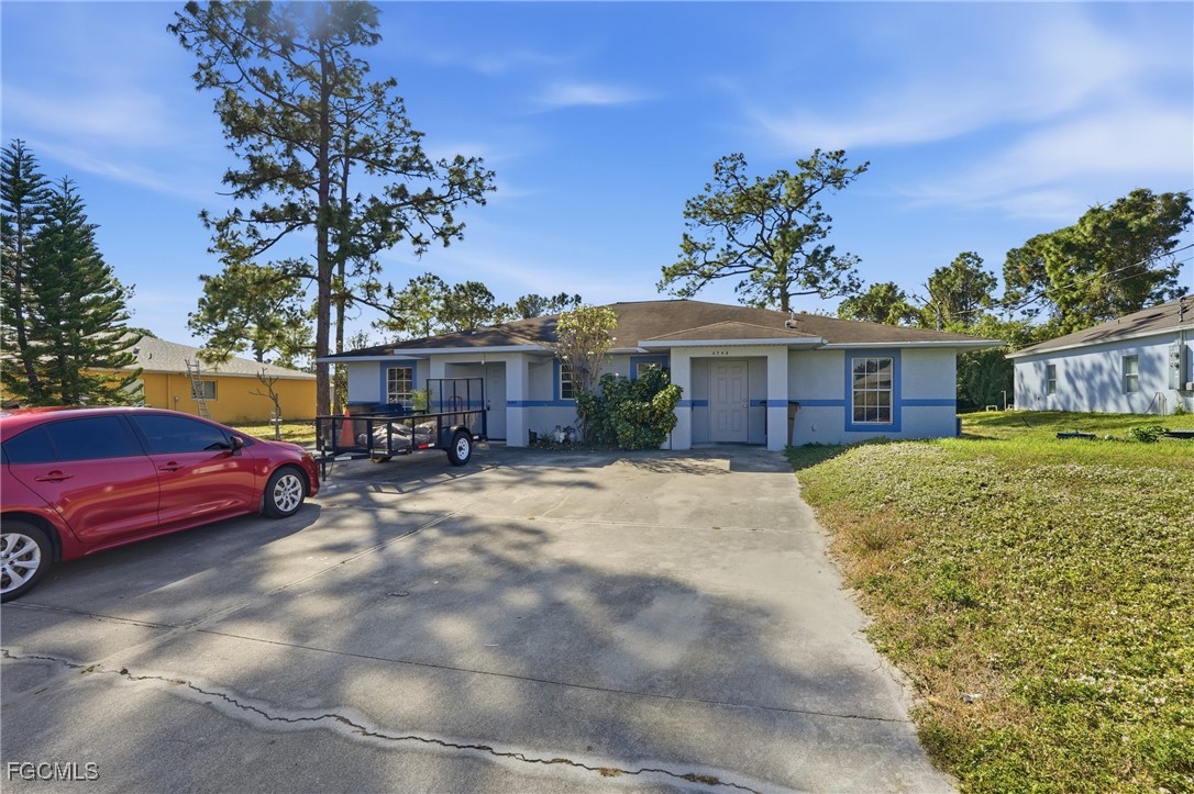 4741-4743 27th Street Southwest Lehigh Acres, FL 33973 - Photo 1 of 13 a view of a house with a patio