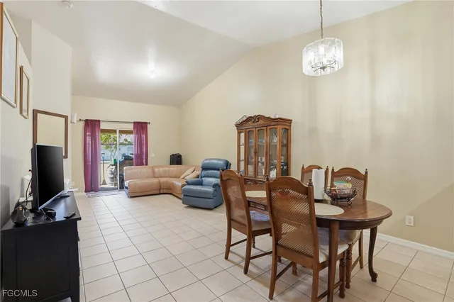 a view of a livingroom with furniture and a chandelier