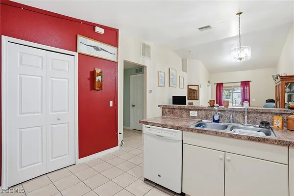 a bathroom with a sink vanity and mirror