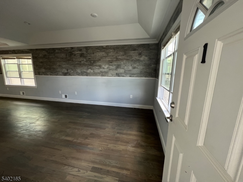 454 3rd Avenue Elizabeth Port, NJ 07206 - Photo 4 of 11 a view of wooden floor and staircase