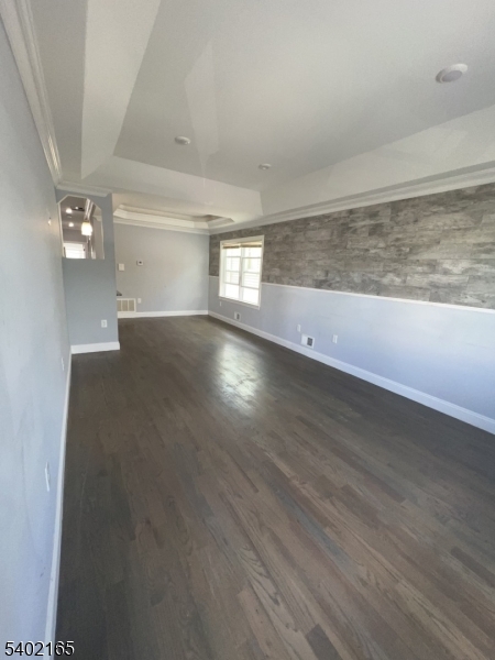 454 3rd Avenue Elizabeth Port, NJ 07206 - Photo 7 of 11 an empty room with wooden floor and windows