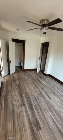 a view of a room with wooden floor