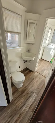 a view of front door with wooden floor