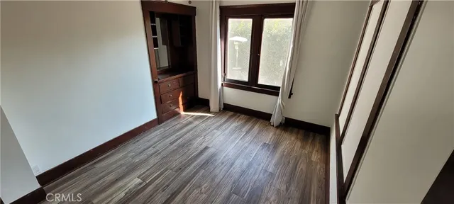 a view of front door with wooden floor