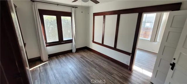 a view of front door with wooden floor and door