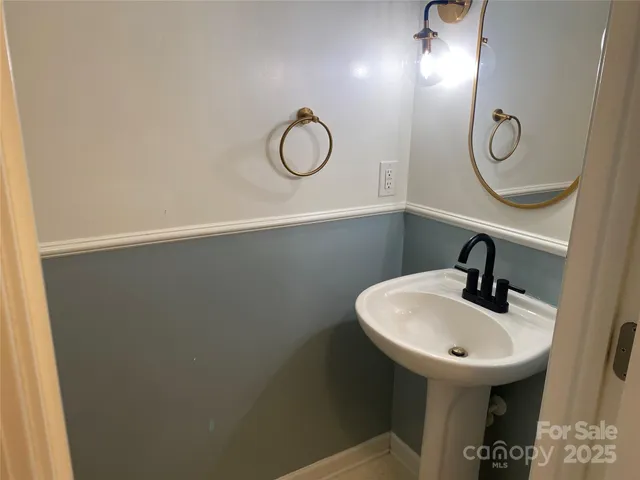a bathroom with a sink and mirror