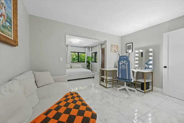 a bedroom with furniture and a window