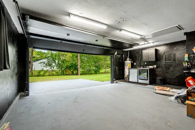 a view of room with gym equipment and a large window