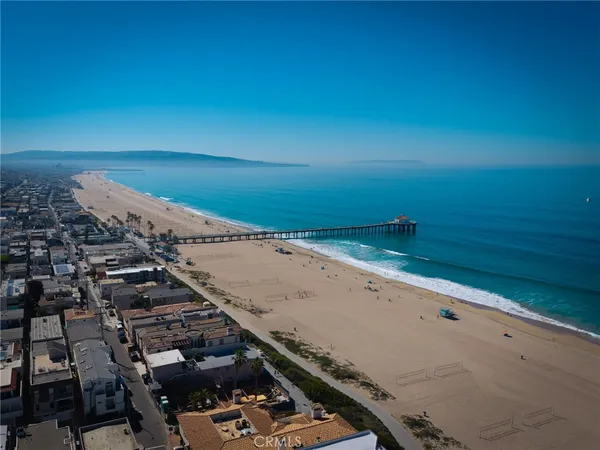 an aerial view of beach and ocean