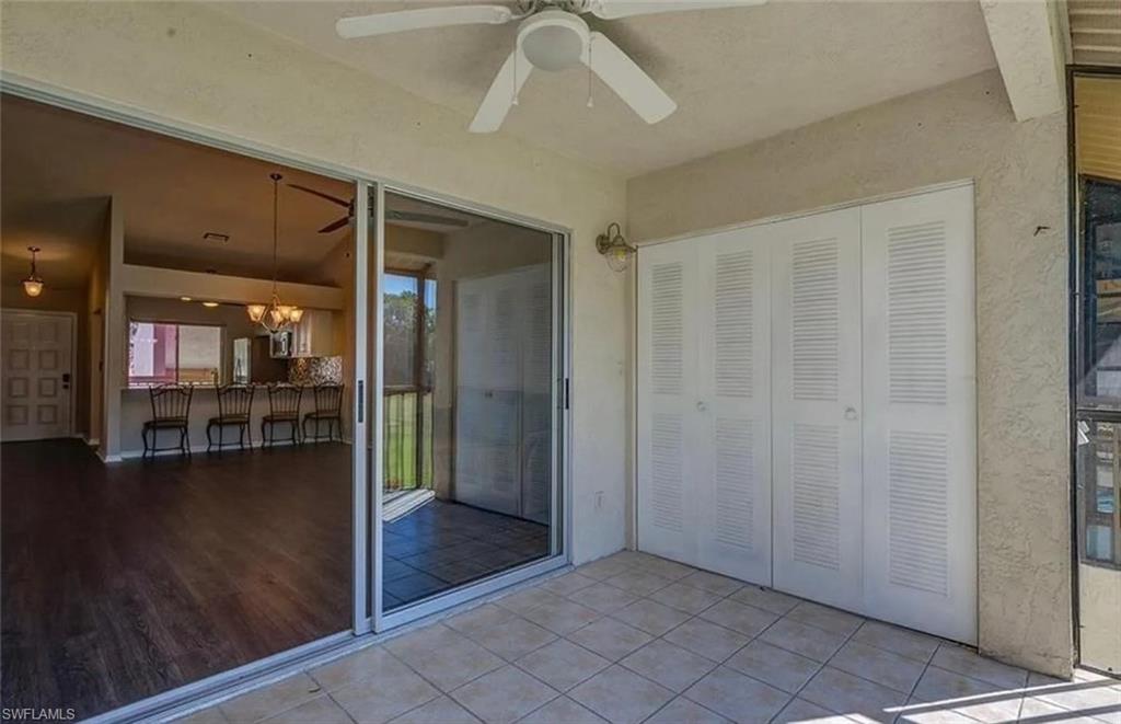 13130 White Marsh Lane, Unit 207 Fort Myers, FL 33912 - Photo 11 of 15 a view of a livingroom with furniture wooden floor and a ceiling fan