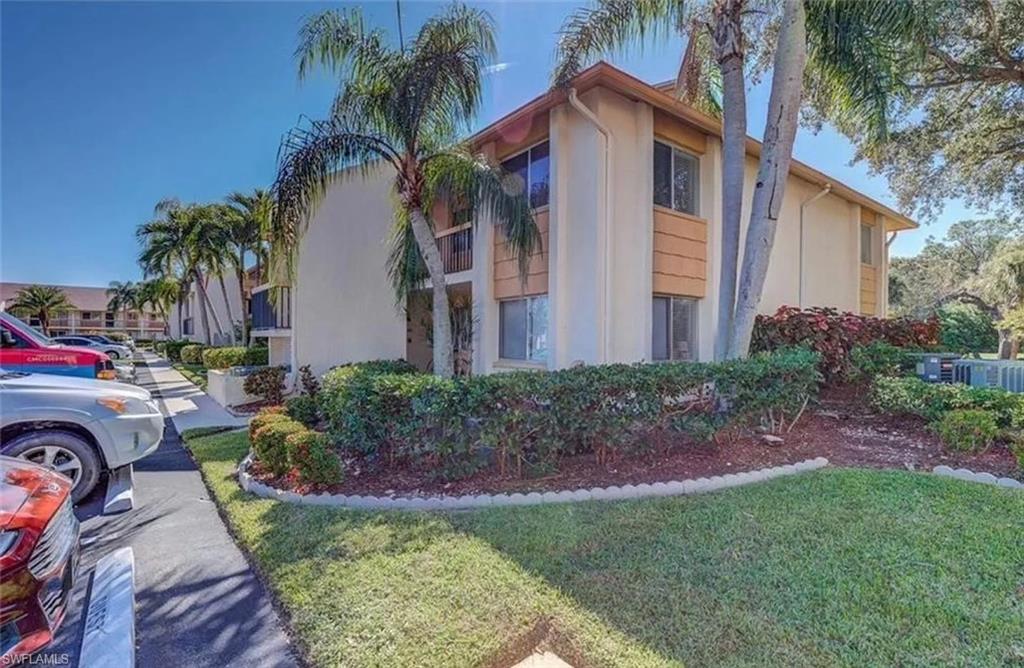13130 White Marsh Lane, Unit 207 Fort Myers, FL 33912 - Photo 13 of 15 a view of a house with a garden