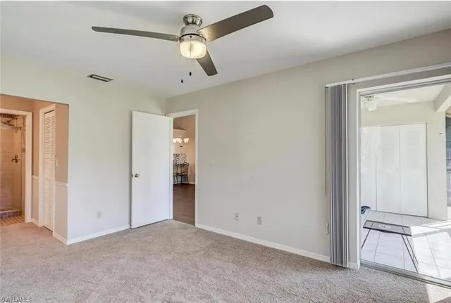 a view of empty room with ceiling fan