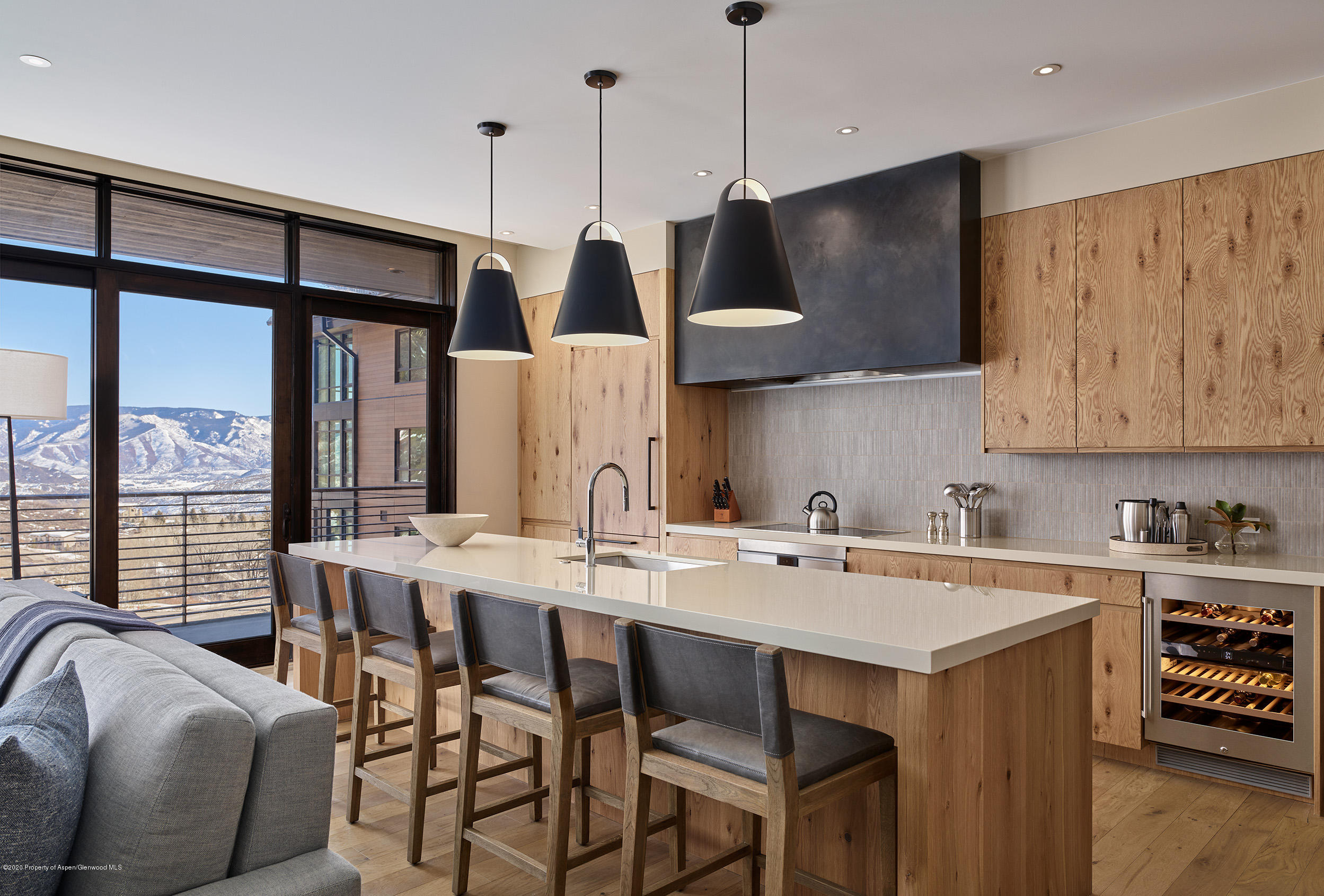 77 Wood Road, Unit 503 EAST Snowmass Village, CO 81615 - Photo 2 of 7 a kitchen with stainless steel appliances granite countertop a sink a stove and a refrigerator