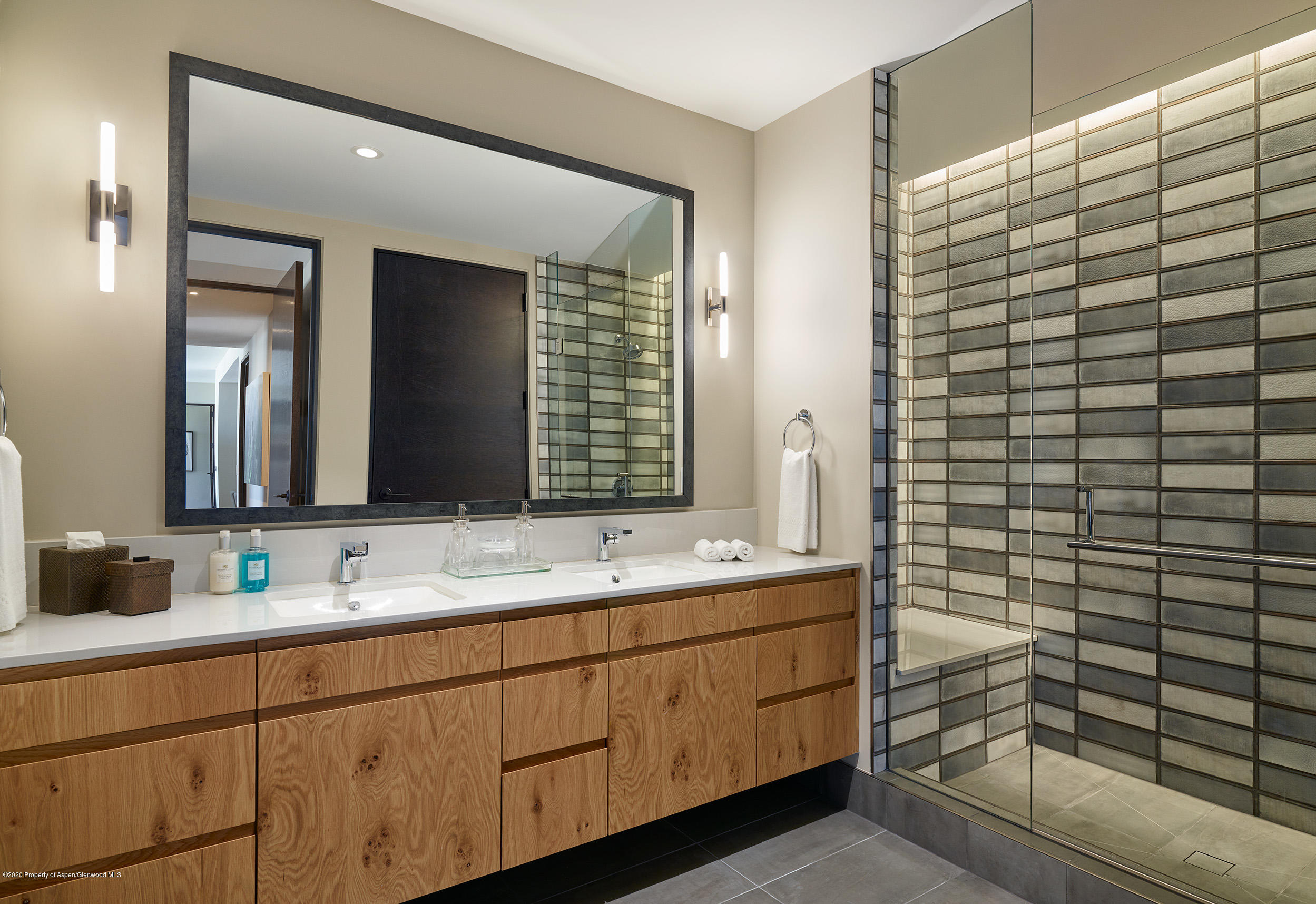 77 Wood Road, Unit 503 EAST Snowmass Village, CO 81615 - Photo 6 of 7 a bathroom with a sink a mirror and shower