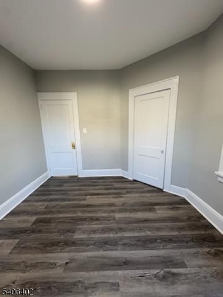 15 Ackerman Street, Unit 1 Bloomfield, NJ 07003 - Photo 12 of 23 a view of empty room with wooden floor