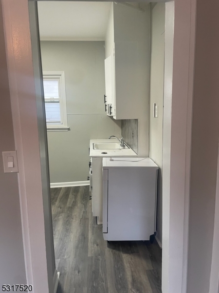 15 Ackerman Street, Unit 1 Bloomfield, NJ 07003 - Photo 19 of 23 a utility room with wooden floor washer and dryer