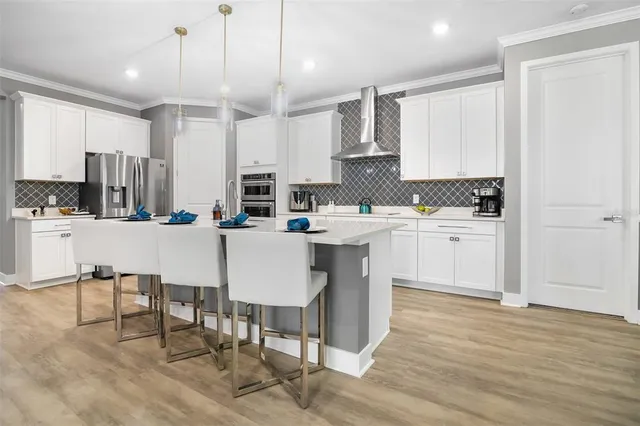 a kitchen with a sink cabinets and window