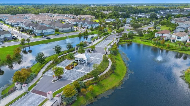 an aerial view of a city with lake view