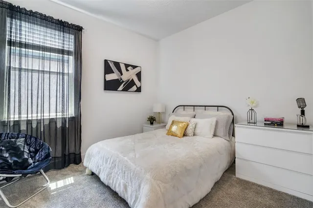 a bathroom with a granite countertop sink mirror shower and toilet