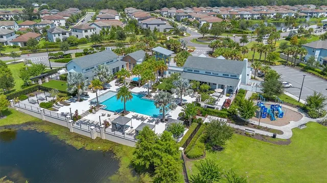 an aerial view of multiple houses with yard